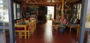 a kitchen and dining room with a table and chairs at Tavan View Homestay in Sapa