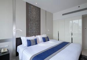 Katil atau katil-katil dalam bilik di Mandarin Hotel Managed by Centre Point
