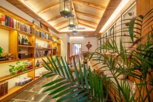 a room with a plant in the middle of it at Yuelu Homestay in Zhangjiajie