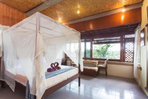 Ein Bett oder Betten in einem Zimmer der Unterkunft Rumah Roda