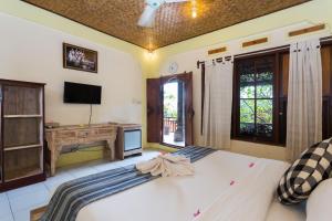 Ein Bett oder Betten in einem Zimmer der Unterkunft Rumah Roda