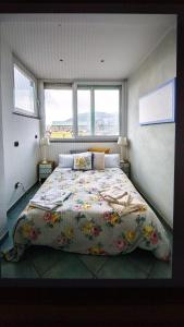 Tempat tidur dalam kamar di La Casa sui Tetti