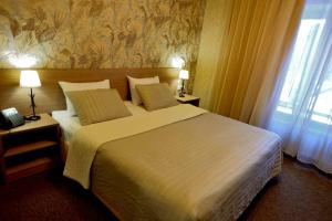 
Кровать или кровати в номере Гостиница Экспотель
