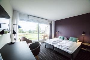 Letto o letti in una camera di Comwell Middelfart