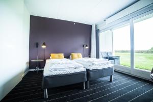 Letto o letti in una camera di Comwell Middelfart