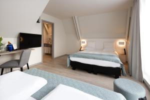 Voodi või voodid majutusasutuse Martin's Brugge toas