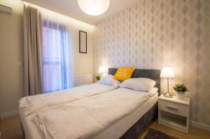 Postel nebo postele na pokoji v ubytování Fitness Apartment - Spa Sauna & Gym by Grand Apartments + 7 fotografií