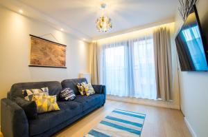 Posezení v ubytování Fitness Apartment - Spa Sauna & Gym by Grand Apartments