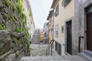an alley with stairs leading up to a building at B28 Apartments Porto in Porto