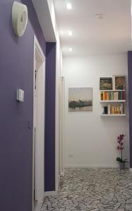 a hallway with a blue and white wall at Il Cantuccio B&B in Bologna