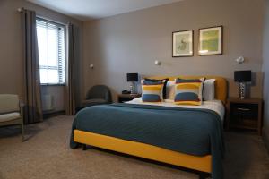 Una cama o camas en una habitación de Coast Rosslare Strand