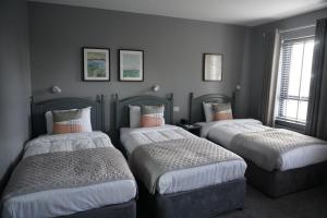 Una cama o camas en una habitación de Coast Rosslare Strand