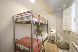 Postel nebo postele na pokoji v ubytování Apartamentos Mirador Alhambra