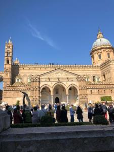 a group of people standing in front of a building at B&B Matteo Bonello in Palermo