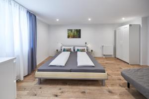 a bedroom with a large bed in a room at Wohnung 7 - nur 5-10 min vom Europa-Park in Ettenheim