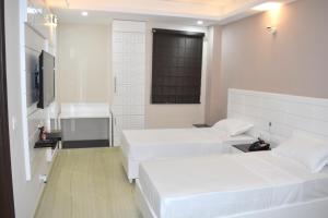 Postel nebo postele na pokoji v ubytování Hotel Tara Palace Redfort