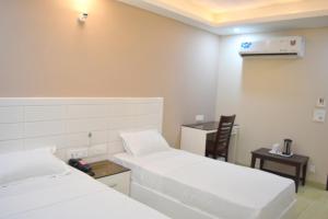 Postel nebo postele na pokoji v ubytování Hotel Tara Palace Redfort