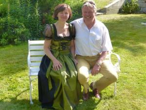 a man and a woman sitting on a bench at Apartment Rubin by Interhome in Saas-Almagell