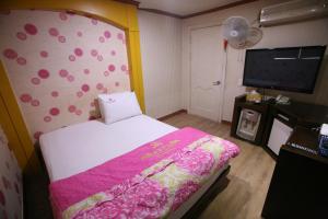 Postel nebo postele na pokoji v ubytování K Motel