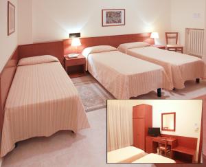 a hotel room with three beds in a room at Il Nocchiero City Hotel in Soverato Marina
