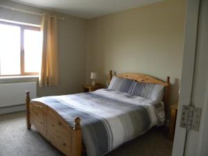 מיטה או מיטות בחדר ב-Orchard lodge Bantry