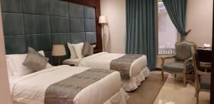 Letto o letti in una camera di Three Points Al Salama