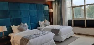 Letto o letti in una camera di Three Points Al Salama