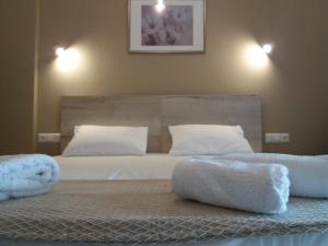 Postel nebo postele na pokoji v ubytování Dimitriou Rooms