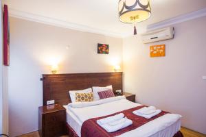 Postel nebo postele na pokoji v ubytování Berce Apartments