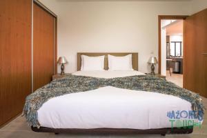 מיטה או מיטות בחדר ב-Silver Gate Home