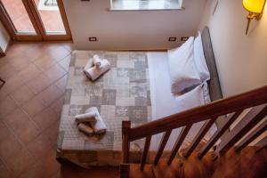 Posteľ alebo postele v izbe v ubytovaní Tina House - Il cortile nel centro storico di Taormina + 23 fotografií