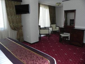 TV a/nebo společenská místnost v ubytování Hestia Hotel