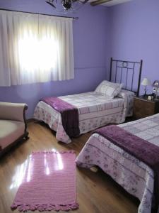 A bed or beds in a room at Albergue San Pelayo
