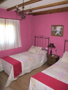 A bed or beds in a room at Albergue San Pelayo