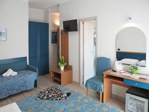 Кровать или кровати в номере Hotel Mondial