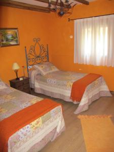 A bed or beds in a room at Albergue San Pelayo