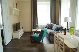 TV a/nebo společenská místnost v ubytování Apartmány Mary