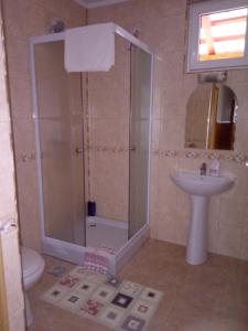 a bathroom with a shower and a sink at Casa VIO in Sighişoara