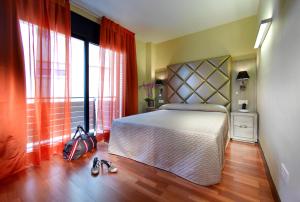 Een bed of bedden in een kamer bij Castro Exclusive Residences Sant Pau