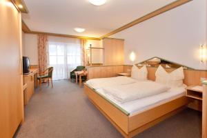Postel nebo postele na pokoji v ubytování Wellness- und Wohlfühlhotel Waldeck