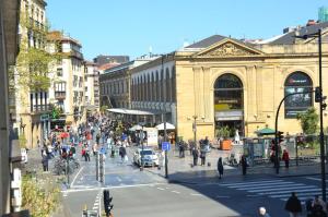 a busy city street with people crossing a street at Boulevard Luxury by Sebastiana Group in San Sebastián