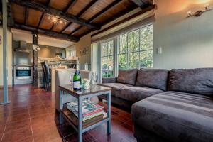 a living room with a couch and a table at Gites La Tabatiere in Vresse-sur-Semois