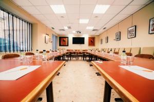 a large conference room with long tables and chairs at Napoleon in Ajaccio