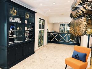 a room with a chair and a display case at Napoleon in Ajaccio