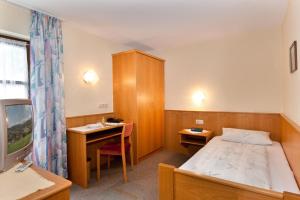 Postel nebo postele na pokoji v ubytování Wellness- und Wohlfühlhotel Waldeck