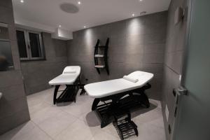 a bathroom with two white sinks in a room at Hotel Terme Cappetta in Contursi