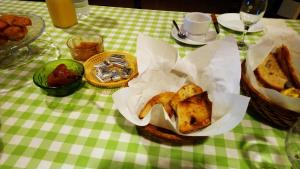 a table with a basket of food on a table at Can Gusó in Castelló d'Empúries