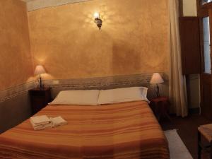 Een bed of bedden in een kamer bij Affittacamere Accà Lascio