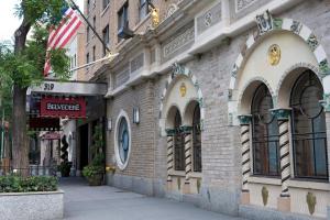 a brick building with arched windows on a street at The Belvedere Hotel in New York