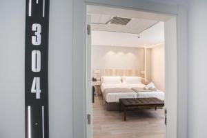 Posteľ alebo postele v izbe v ubytovaní DWO Ábaster